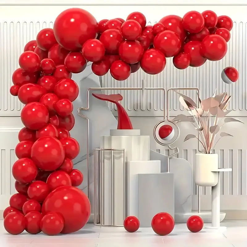 The Party Empress Red collection features a sea of red balloons, some helium-filled floating gracefully near the ceiling, others tied in bunches or arches around the room. 