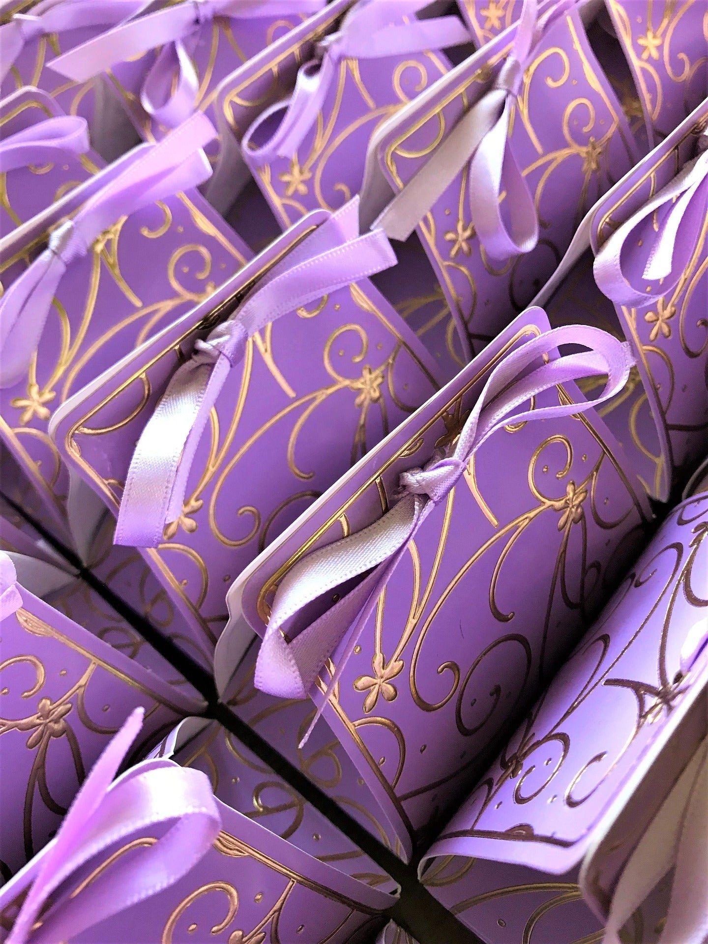 purple favor bags swirl decorative ribbon 